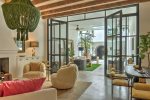 Living Room opens to outdoor sitting area and pool